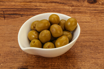 Green pickled olives in the bowl