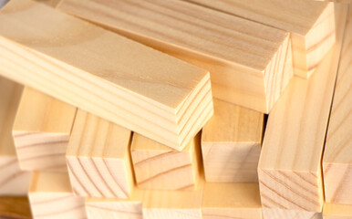  small wooden blocks stacked on. Wood texture, background. Jenga wooden planks. High quality photo