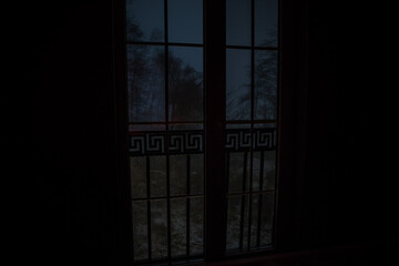 View from window frame to the winter forest at night. Selective focus