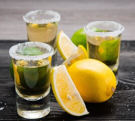 Tequila drink served in glasses with lime and salt