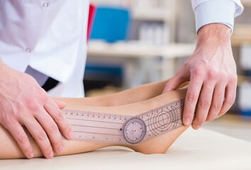 Doctor checking patients joint flexibility