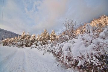Majestic sunset in the winter mountains landscape. Dramatic sky. Azerbaijan nature.