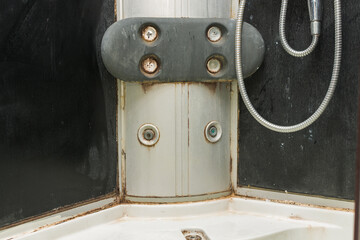 close-up of a dirty shower cabin, everywhere there is dirt, fungus, mold. Dirty joints and corners....