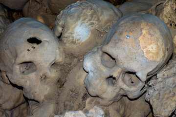 Skulls in cannibal skull cave in Papua New Guinea 