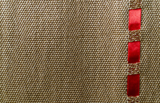 Closeup Shot Of A Fabric Texture Background With Red Tape