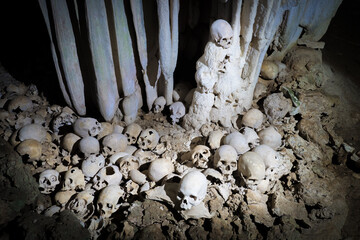 Skulls in cannibal skull cave in Papua New Guinea  - obrazy, fototapety, plakaty