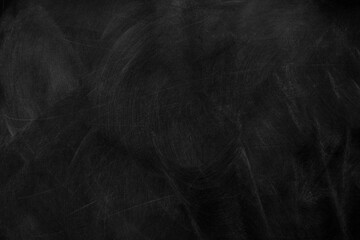 Texture of chalk on black chalkboard or blank blackboard background. School education, dark wall backdrop, template for learning board concept.