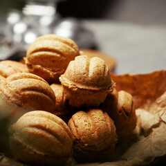 Chriatmas food. Shortbread russian walnut shaped cookies Oreshki with caramel.Close-up