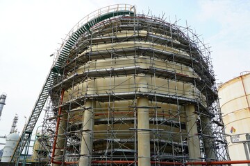 Large industrial tanks or spherical tanks and have scaffold installation work for petrochemical plant, oil and gas fuel or water in refinery or power plant for industrial plant.