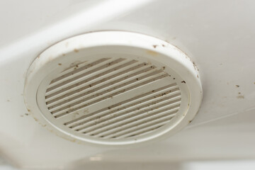 close-up of dirty ventilation cover for shower stall. soft, selective focus, horizontal photo. Idea - Harmful bacteria, microbes can multiply in a humid environment.