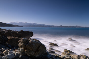 Fototapeta na wymiar Long exposure of the rocks and sea on a winter day, in Corsica