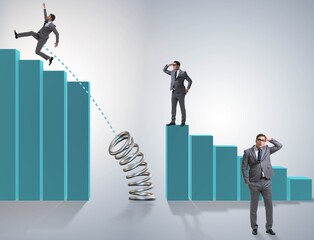 Business people jumping over bar charts