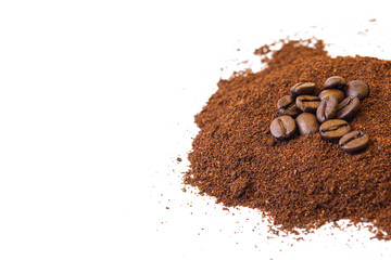 Roasted coffee beans at the top of a pile of ground coffee on an isolated white background. With white area for copy space text.