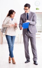 Real estate agent showing new apartment property to client