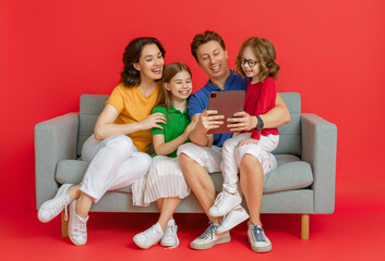Happy loving family on bright color background