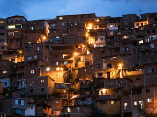 Panorama night cityscape of Juan XXIII neighborhood in San Javier Comuna 13 Medellin Colombia South America