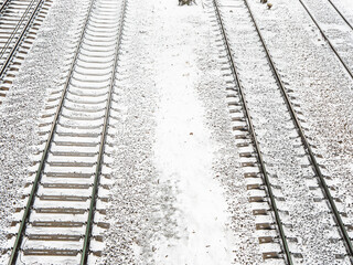 Snow covered railway track in winter, top view - winter background, copy space