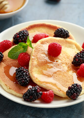 Morning breakfast Pancakes with fresh berry and honey. Healthy food