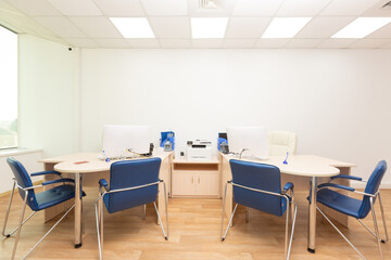 the interior of the office. Office tables, chairs. Computers, copy machine