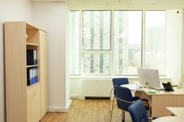 The interior of the office. Desk with a computer, a filing Cabinet for documents