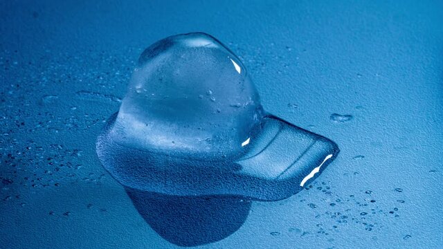 Ice Cube Melting Time-lapse With Cold Blue Background