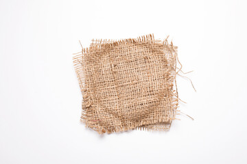 Old burlap fabric, sackcloth patch on white background