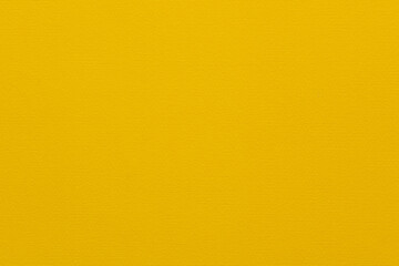 Fototapeta premium Close-up of textured grooved paper surface in bright yelllow