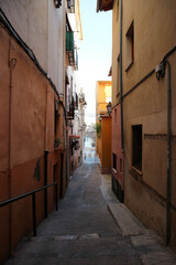 Obraz na płótnie Canvas cosy beautiful narrow street in old spanish town Xativa, province of Valencia