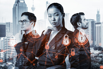 Group of business colleagues as a part of multinational corporate team working on project to protect clients information at cybersecurity compliance division. IT lock icons over Kuala Lumpur