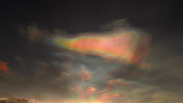 Majestic Iridescent Cloud In The Sky During Sunset In Iceland. - Low Angle, Static