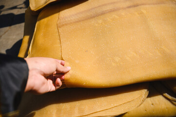 Para rubber sheet with farmer hand,Ribbed Smoked Sheets are coagulated rubber sheets processed from fresh field latex