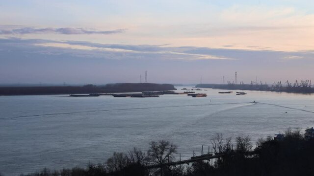Motion Timelapse Of Boats Sailing On Danube River At The Port Of Galati In Romania On A Sunset, wide shot