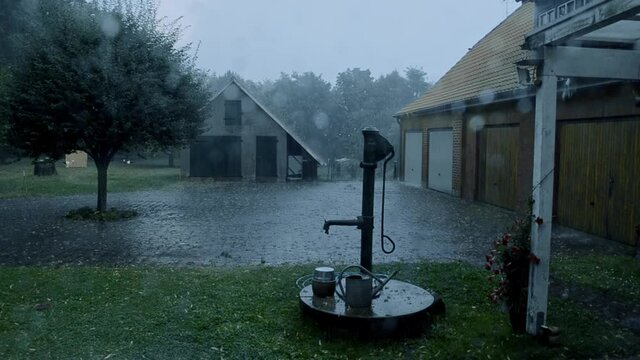 Heavy summer rain storm on german farm