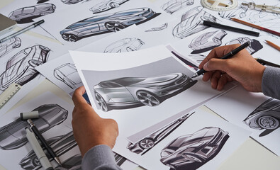 Designer engineer automotive design drawing sketch development Prototype concept car industrial creative.