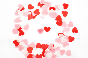 Obraz na płótnie Canvas Red pink and white hearts on a white background. Valentine's day concept. Selective focus. Postcard. Background.