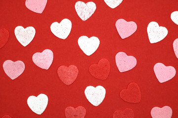 Red pink and white hearts on a red background. Valentine's day concept. Selective focus. Postcard. Background.