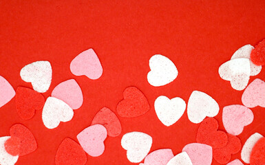 Red pink and white hearts on a red background. Valentine's day concept. Selective focus. Postcard. Background.