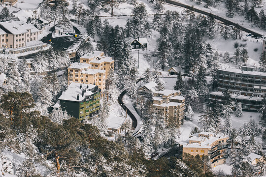 Puerto de Navacerrada village at sunset after winter snowfall, Madrid