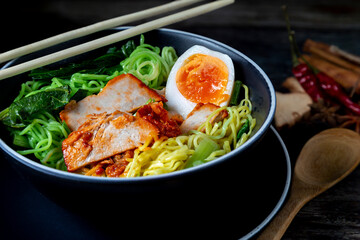 Red Pork Noodles with Boiled Egg in a Bowl Thai street food