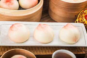 A peach-shaped birthday bun known as the Longevity Peach.Chinese specialty pastry，