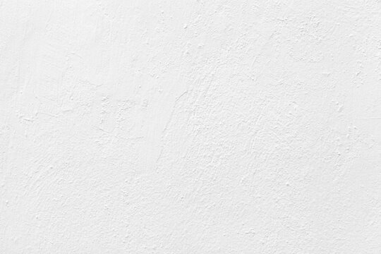 Old cement wall painted white texture and seamless background