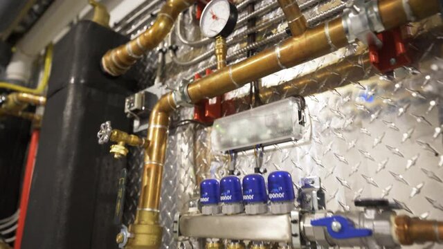 Hydronic heating system with valves tubes pipes boilers heat for recirculating hot water to efficient baseboard radiant in-floor