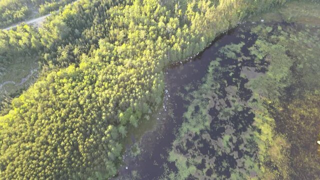 Revealing aerial shot of Mount Katahdin, forrest and lakes in Baxter State Park
