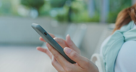 Woman use of mobile phone at outdoor