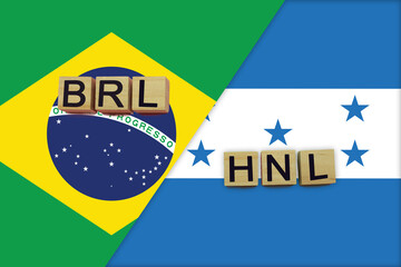 Brazil and Honduras currencies codes on national flags background