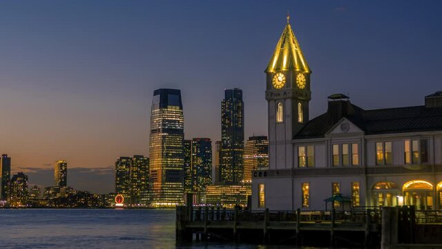 Sunset timelapse of Pier A Harbor House in Lower Manhattan with Colgate clock and New Jersey in the background.