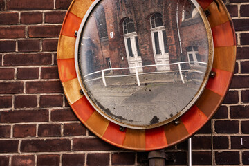 old mirror on brick wall