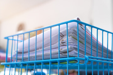 Stack of paper documents rack files on wireframe filing tray, information of finance on high work desk office, commercial report papers or piles of unorganized project achieves, Busy Business concept
