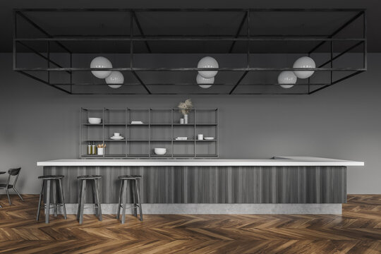 Dark gray pub interior with bar counter