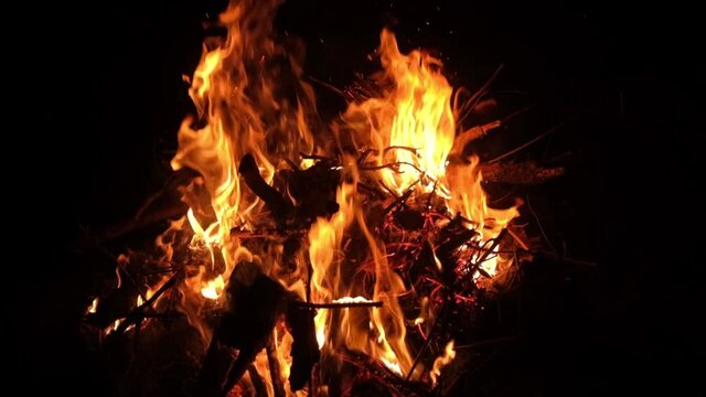 Beautiful close up shot of Backyard Bonfire in slow motion at night in 4k.